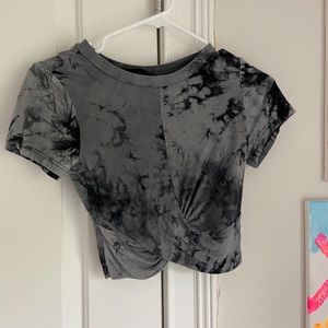Black and grey tie dye crop top with cross material at the bottom